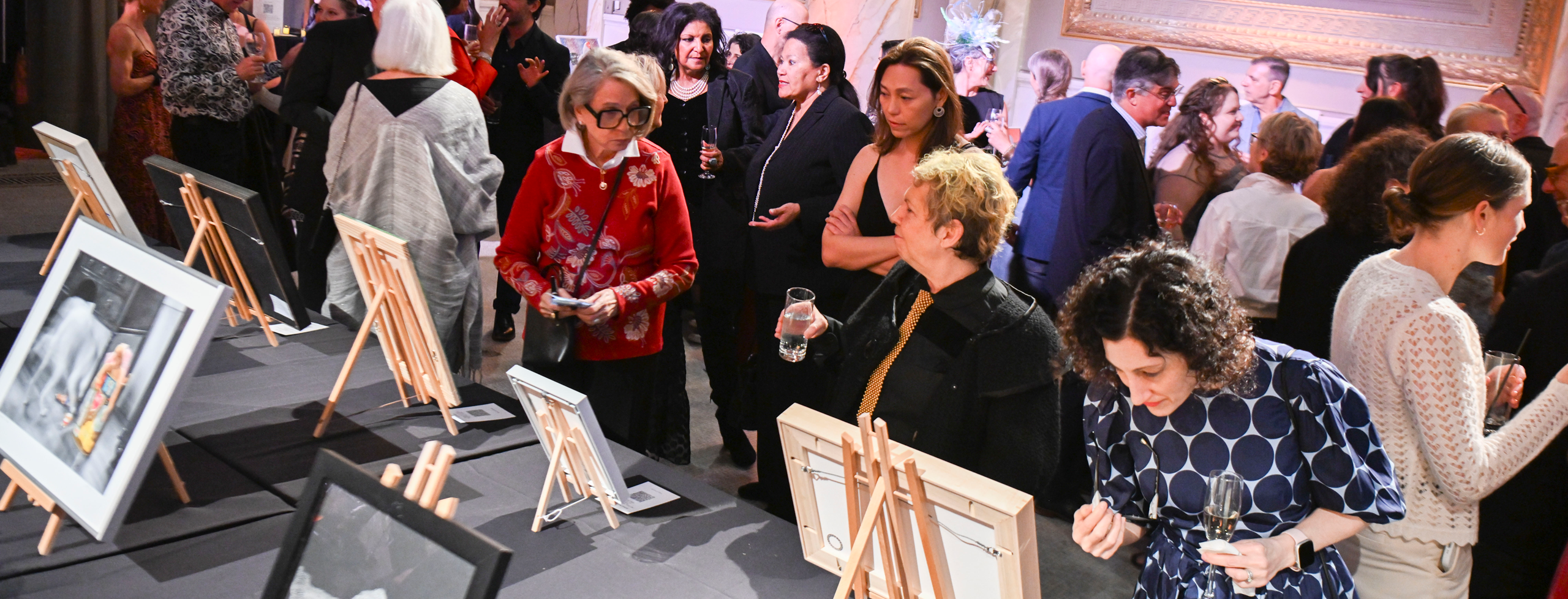 2026 Hall of Fame guests during cocktail hour, enjoying the art auction