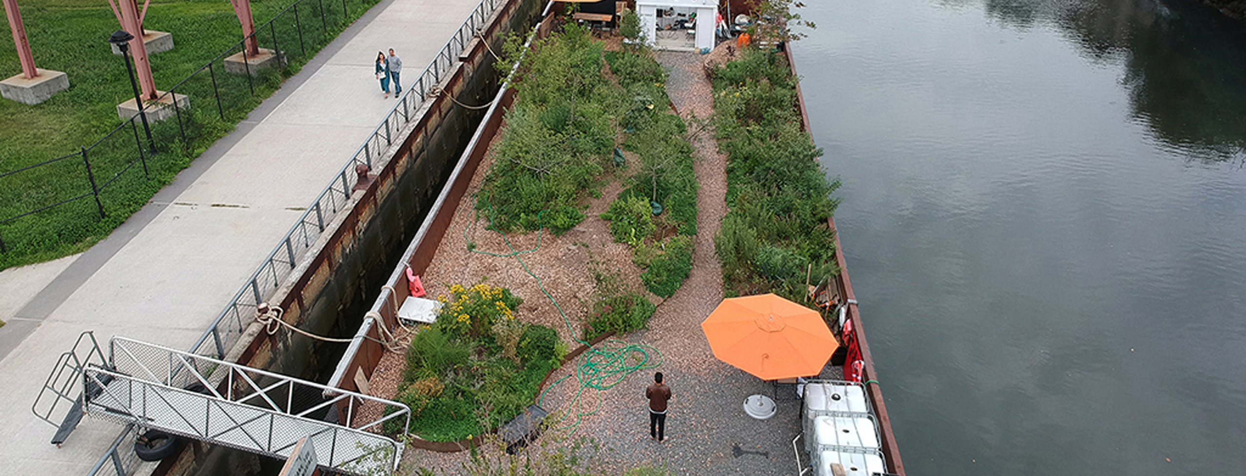 Swale, a 130 x 40' barge with an edible landscape atop. It docks adjacent to public parks. People can come onto Swale to pick fresh food for free.